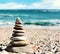 Stones balance, pebbles stack over blue sea in Crimea.