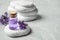 Stones, bottle of essential oil and lavender flowers on table. Space for text