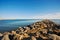 Stones breakwaters to protect coastal structures from destructive impact of storm sea waves. Cabopino beach