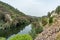 Stones and bushes on a hill by the Mondego river, Penacova PORTUGAL