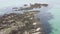 Stones exposed after low tide in the middle of the sea, seascape. Top view of the sea