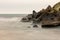 Stones laid on a breakwater in a sea port. The exhibition photographed with a long time