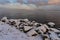 Stones by Lake MjÃ¸sa in winter