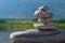 Stones meditation figures. Symbolical statue of several stones. Tradition to collect  stones in private. Beautiful water landscape