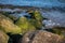 Stones overgrown with moss in the sea, Kolka, Latvia