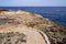 Stones pathway in rocks access to beach sea in coast Juan-les-Pins in Antibes France