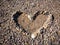 Stones and pebbles form heart shape