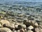 Stones pebbles rocks in blue sea
