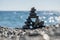 Stones and pebbles stack, harmony and balance, One big pyramid stone cairn on seacoast