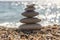 Stones and pebbles stack, harmony and balance, one stone cairn on seacoast