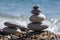 Stones and pebbles stack, harmony and balance, two stone cairns on seacoast