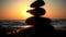 Stones pyramid on beach symbolizing zen, harmony