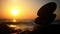 Stones pyramid on pebble beach symbolizing zen