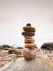 Stones pyramid symbolizing zen, harmony, balance pebbles. Ocean in background