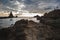 Stones and rocks on Cabo de Gata, Almeria, Spain with lighthouse