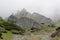 Stones and rocks on mountainside in fog