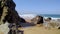 Stones and rocks on sandy beach in Portugal the west Atlantic