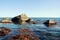 Stones and rocks in the sea blue water, clear water surface