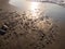 Stones on the sandy beach. Quiet place. The silence of the waves Edge of the coast. Background of sand and stone. Black sand on