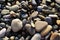 Stones on the seashore, pebbles on the beach, background.