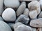 The stones at the shingle beach at the sea background