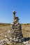 Stones stacked in balance in a pyramid shape in mountain landscape. Health and natural harmony concept