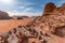 Stones stacked to cairns in Wadi Rum red sand desert on a sunny day, Jordan, Middle East