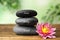 Stones with words Mind, Body, Soul and lotus flower on table. Zen lifestyle