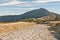 Stony hiking trail near Obri sedlo with Snezka hill on the background