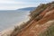 Stony, pebble and clay banks of the Volga River. Mountain slope of various stone rocks. Spring cloudy day with rain. Beautiful