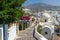 Stony road to Thira town among churches and traditional houses on Santorini island, Greece