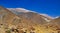 Stony sandy coastal adventure hiking trail in beautiful unreal dry life hostile desert landscape towards seemingly impassable