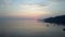 Stony seacoast and mountains on a sunset. Indonesia. Bali.