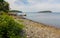 Stony shore with grasses and islets in the horizon at Agamont Park, Bar Harbor in Maine, USA