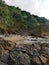 Stony staircase leading from sandy rocky beach to green luscious hills of Mindoro