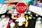 Stop antibiotics or medication excess with colorful pharmaceutical drugs with stop sign on top