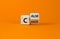 Stop chaos, time to calm. Turned a wooden cube and changed the word `chaos` to `calm`. Beautiful orange background, copy space