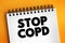 Stop COPD text on notepad, medical concept background