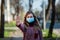 Stop Corona Virus. Woman in city street in face mask. COVID-19 And Quarantine Concept