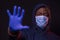 STOP Coronavirus, black man shows the stop sign, wearing protective mask and gloves