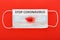 Stop coronavirus text on protective surgical masks with blood, hemoptysis on red background.Chinese Coronavirus, wuhan virus,