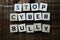 Stop cyber Bully alphabet letters on wooden background