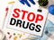 Stop Drugs words on Brick Wall Addiction awareness, Say No to Substances Abuse concept