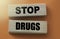 Stop drugs words on wooden blocks. Stop abuse healthcare concept