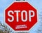 Stop Eating Animals - Sticker Art on a Stop traffic sign; protest against eating animals.