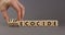 Stop ecocide symbol. Businessman turns wooden cubes and changes words ecocide to stop ecocide. Beautiful grey background, copy