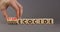 Stop ecocide symbol. Businessman turns wooden cubes and changes words ecocide to stop ecocide. Beautiful grey background, copy