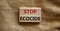 Stop ecocide symbol. Wooden blocks with words stop ecocide. Beautiful canvas background, copy space. Business, ecological and stop