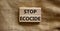 Stop ecocide symbol. Wooden blocks with words stop ecocide. Beautiful canvas background, copy space. Business, ecological and stop