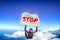 Stop. Flag in skydiving. People in free fall.Teampleat skydiver. Extreme sport.